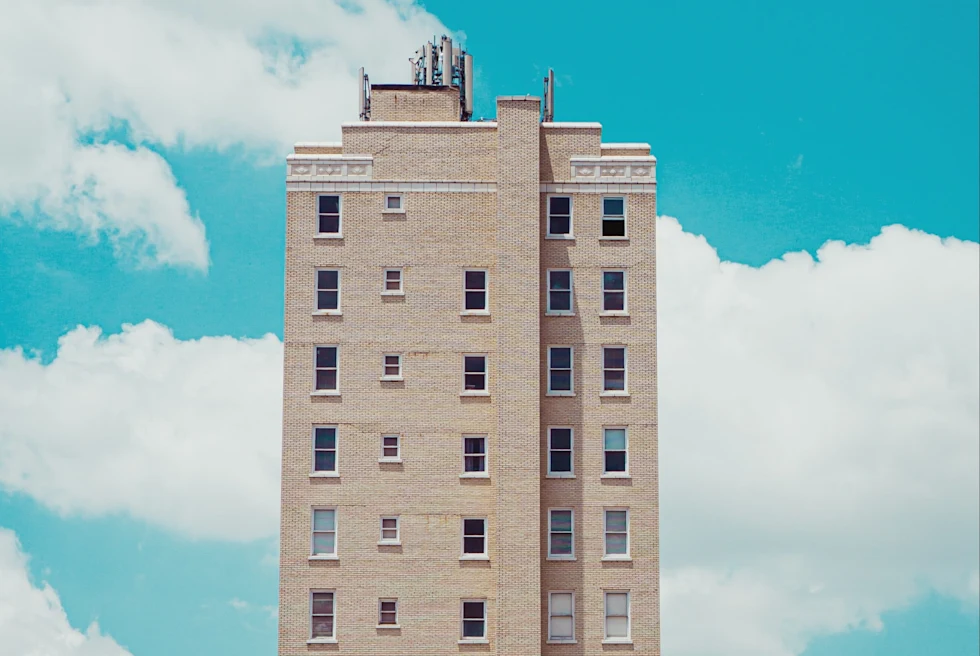 skyscraper with a bright blue sky behind