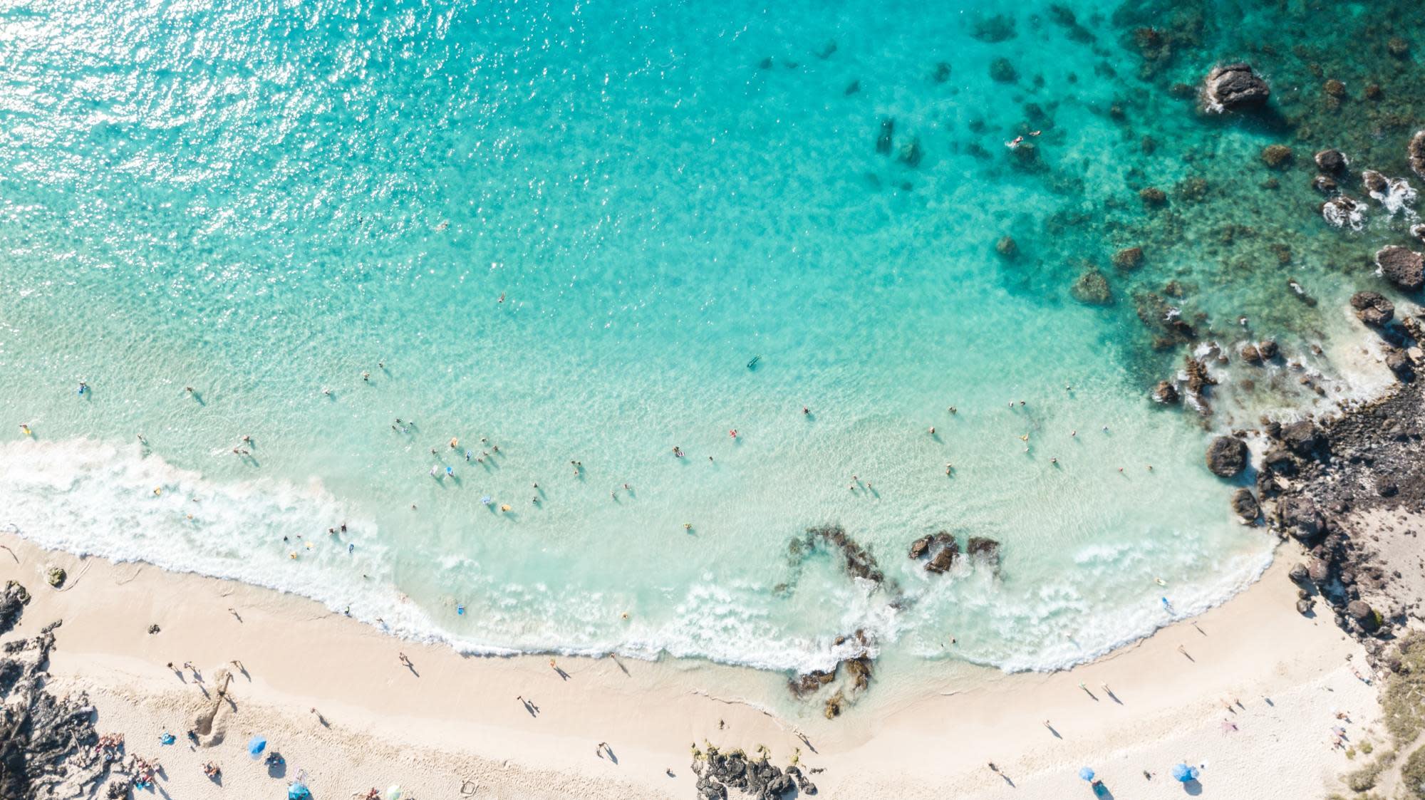 the-12-best-places-to-stay-in-hawaii-islands-and-hotels-aerial beach shot