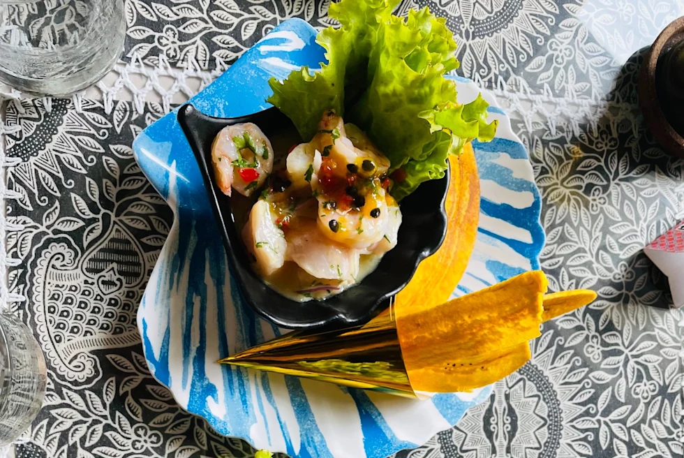 white chair and table next to pink bench
