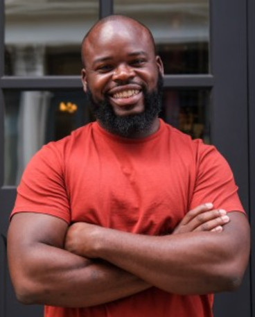 Fora's Senior Frontend Engineer Victor Okon smiling at the camera