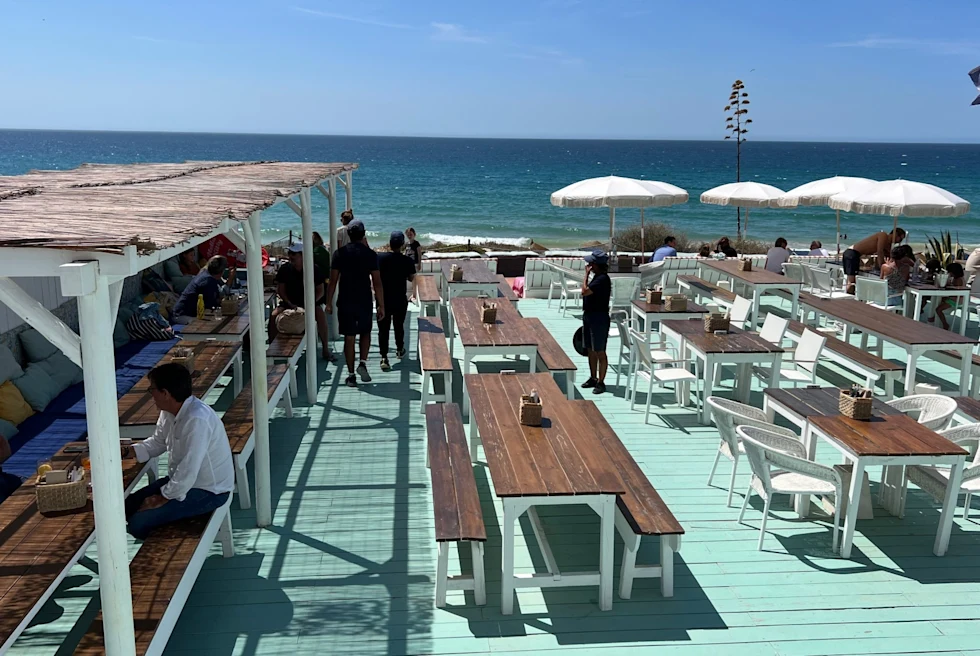 Outdoor sitting on beach deck.