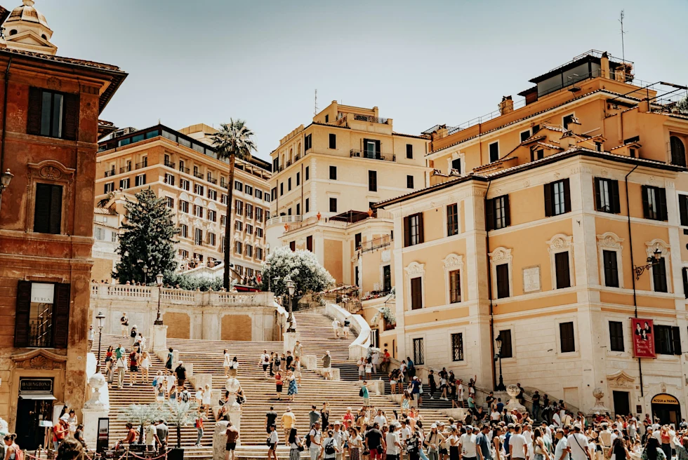 The Spanish Steps is an iconic Roman landmark, a monumental staircase adorned with elegance and history, connecting Piazza di Spagna to the Trinità dei Monti church.