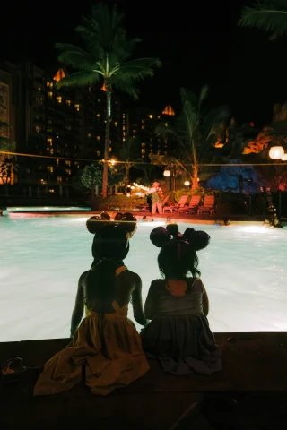 Two girls with Mickey Disney ears in Hawaii. 