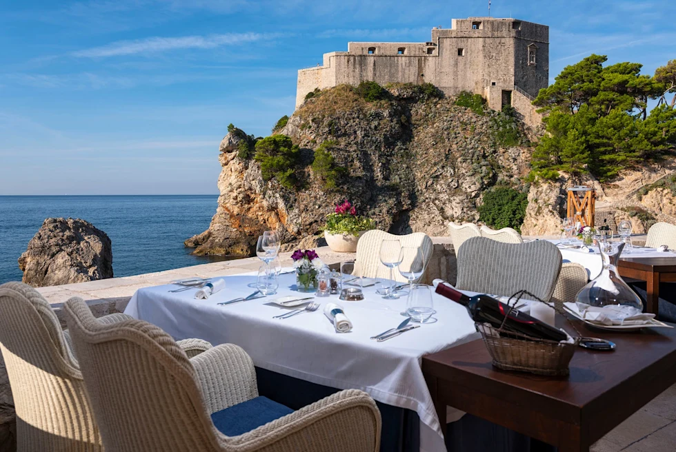 A restaurant table overlooking the sea.