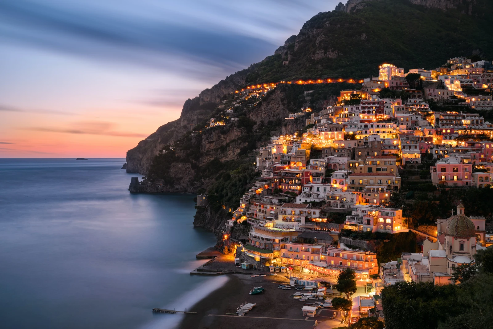 houses on the side of a cliff during nighttime