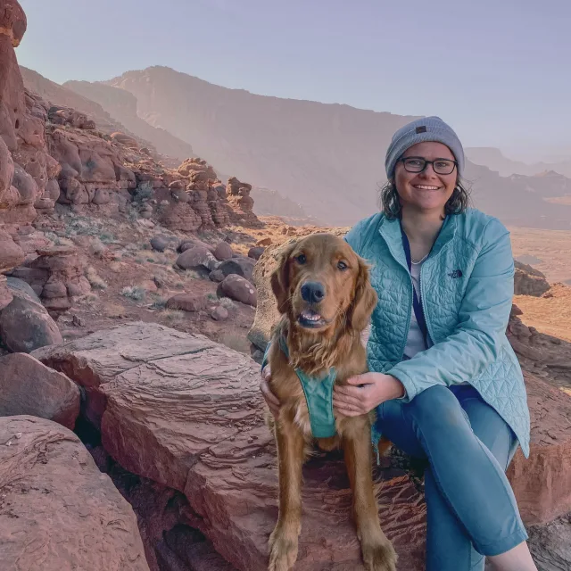 Travel advisor posing with a dog