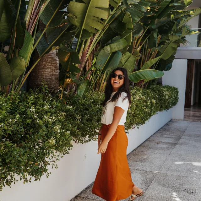 julissa in an orange skirt