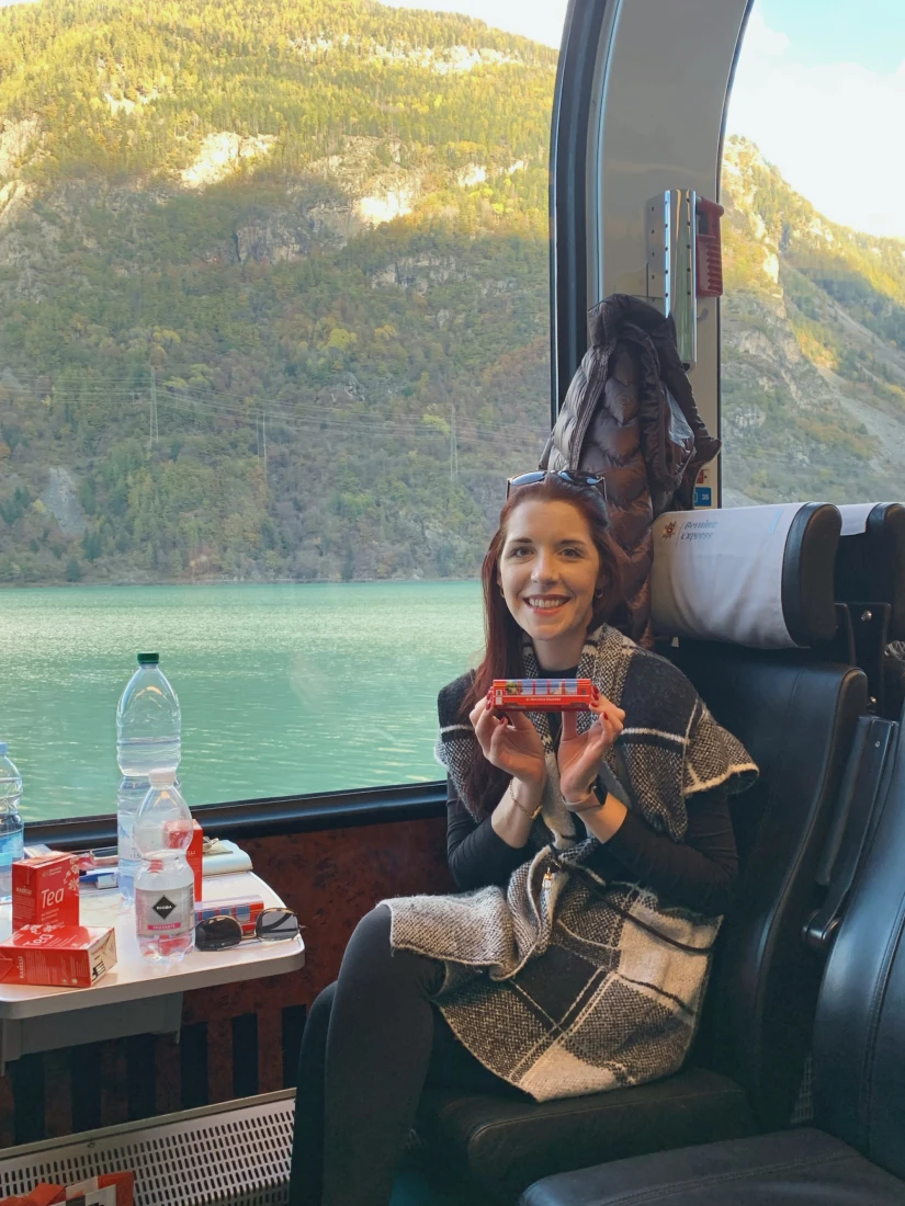 Travel advisor posing in a train