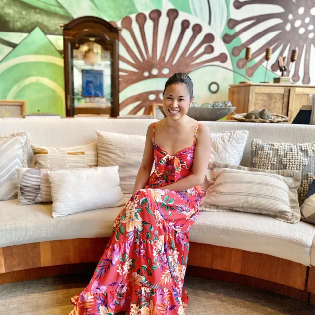 Fora travel agent Kristyne Wada wearing floral dress 