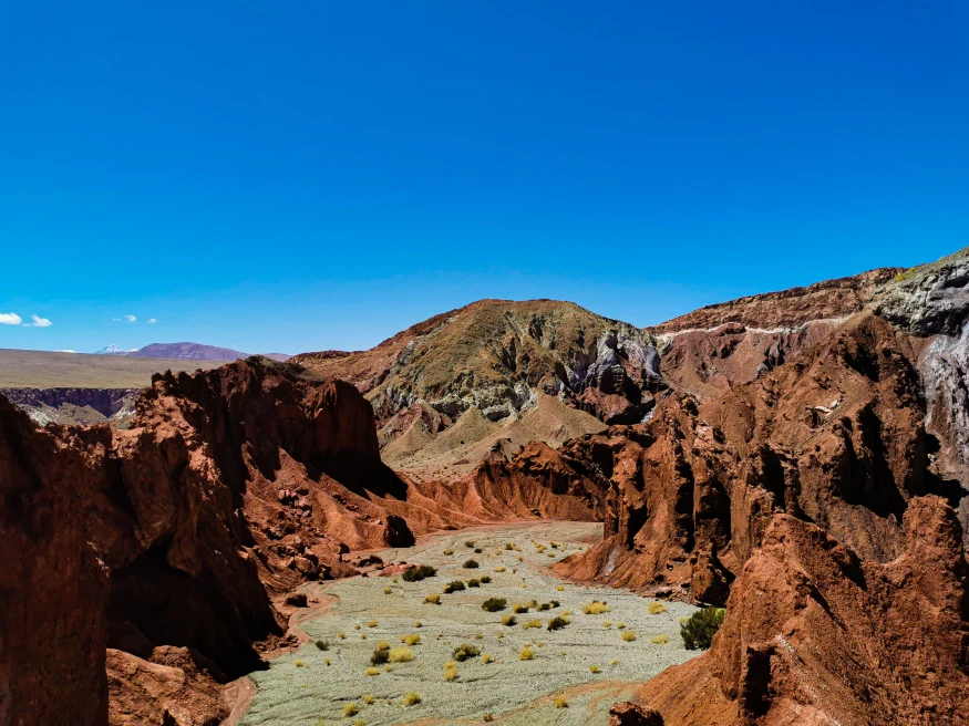 multicolored rocks in the desert with blue sky