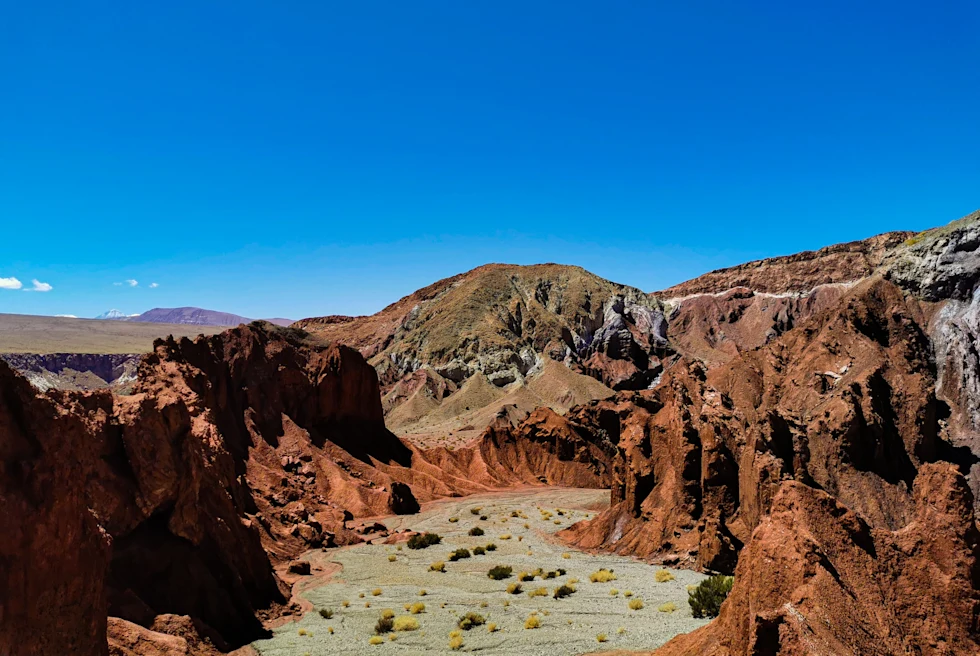 multicolored rocks in the desert with blue sky