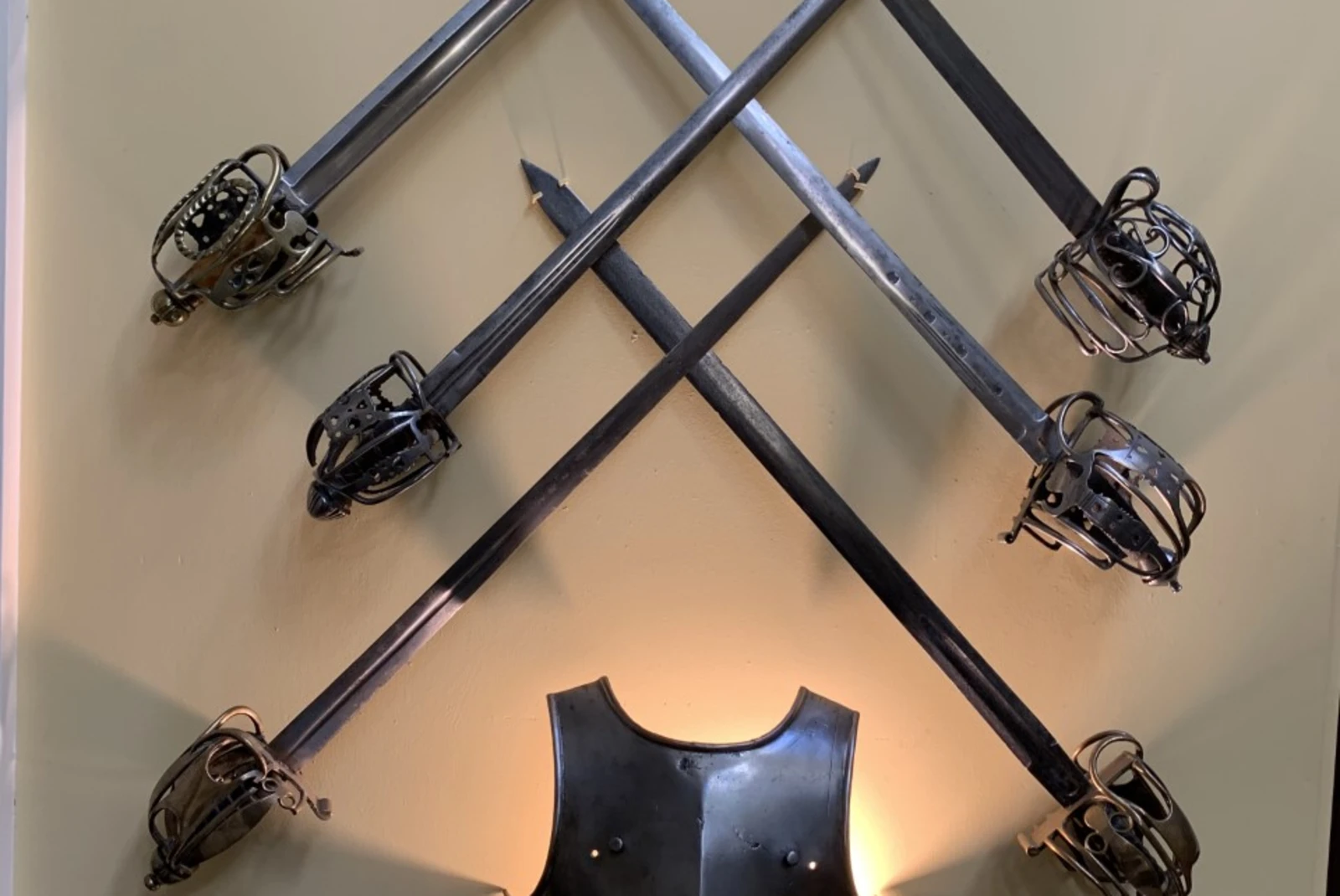 iron swords displayed on a wall 