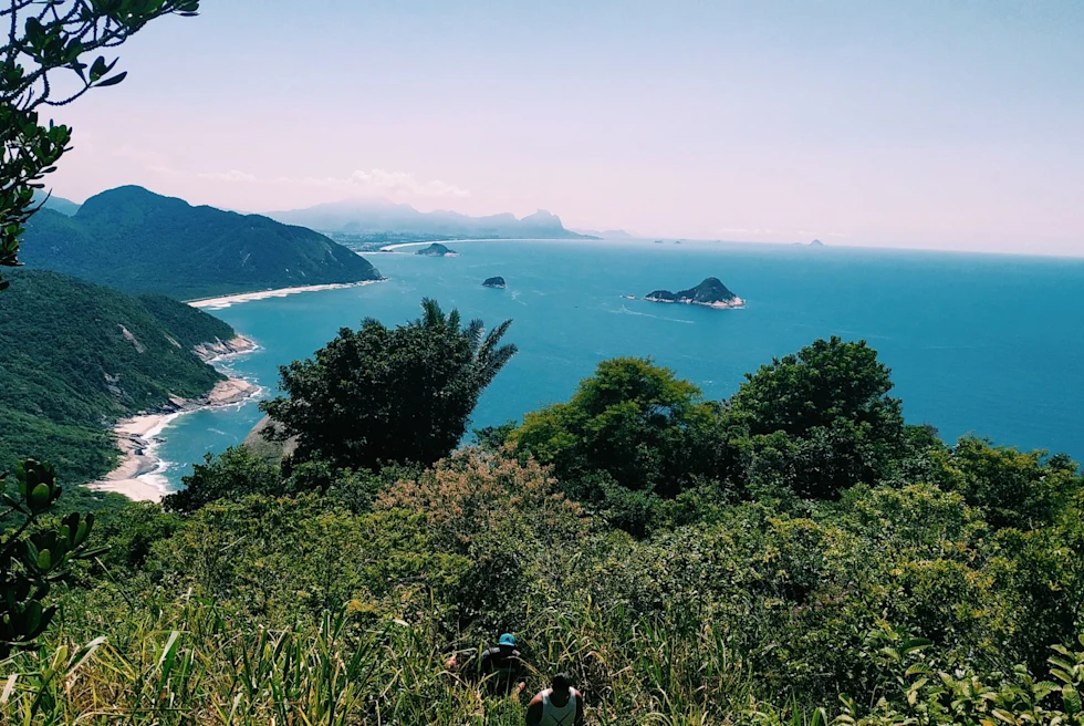 Beach with green hills around.