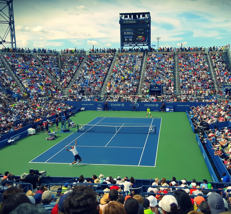 large crowded tennis stadium during daytime