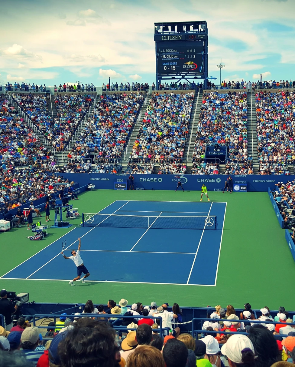 large crowded tennis stadium during daytime