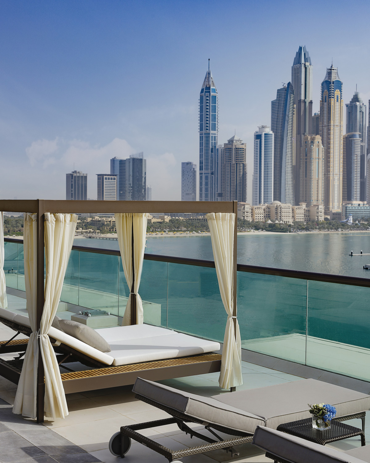 Chic pool and cabanas overlooking Dubai