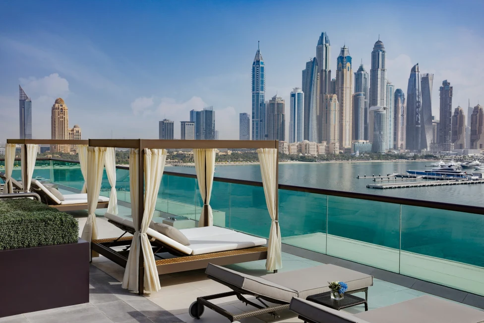 Chic pool and cabanas overlooking Dubai