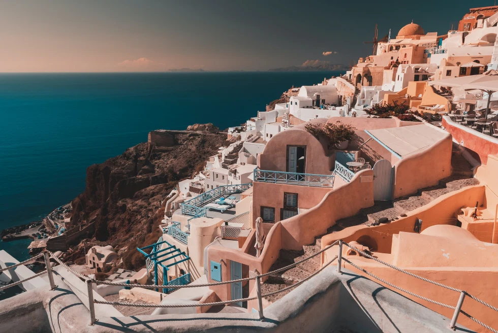 Oia is a picturesque village perched on the cliffs of Santorini, known for its iconic blue-domed churches, stunning sunsets, and panoramic views of the Aegean Sea.
