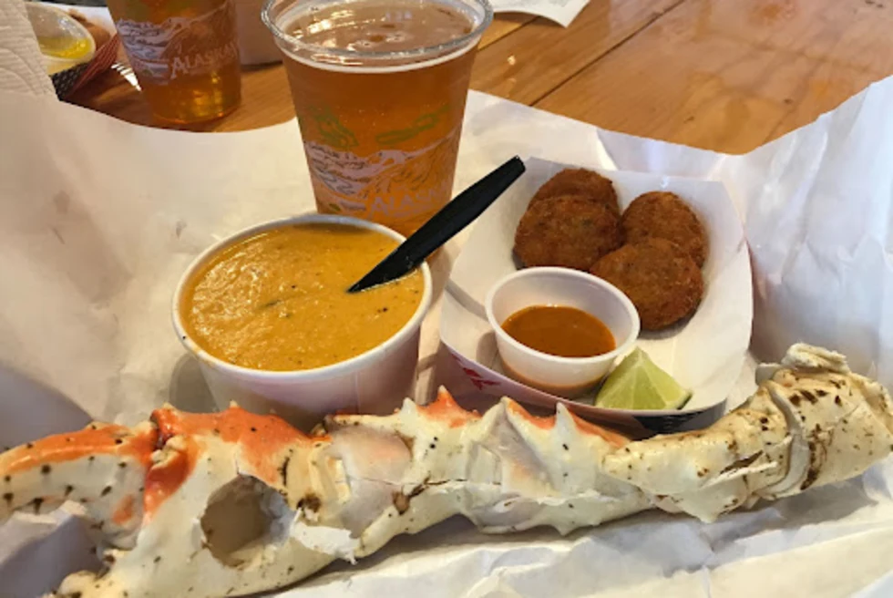 Platter of seafood with cup of soup and cup of beer