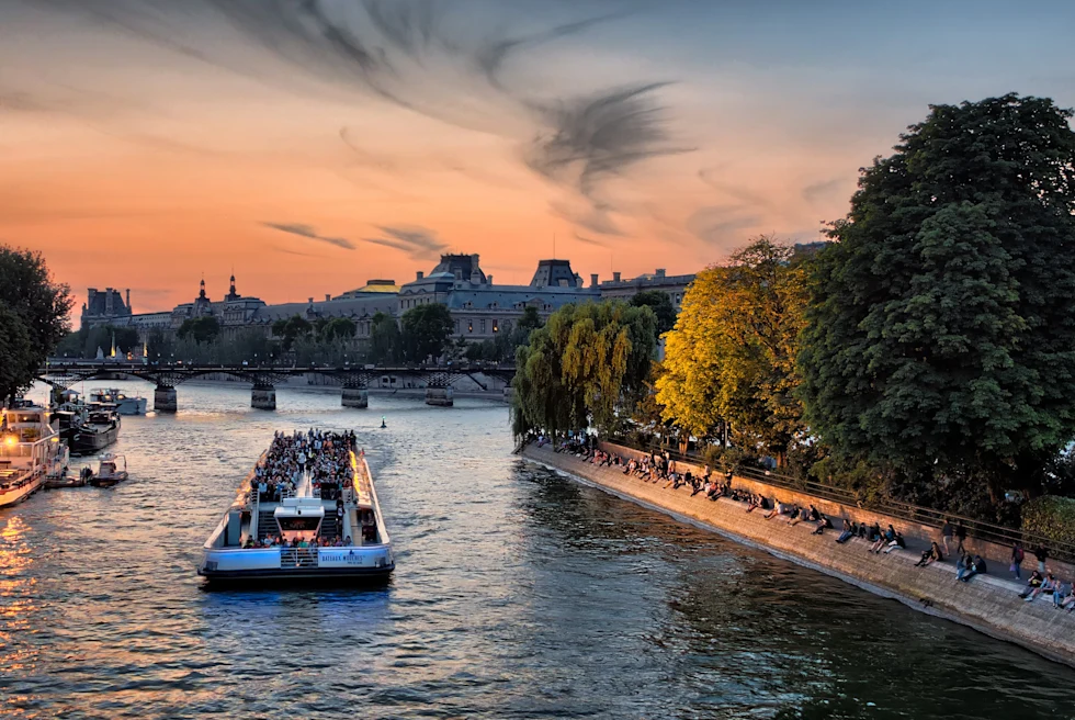 boat in a body of water during sunset