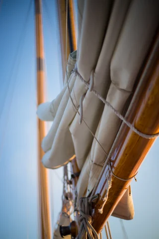 A mast of a boat. 