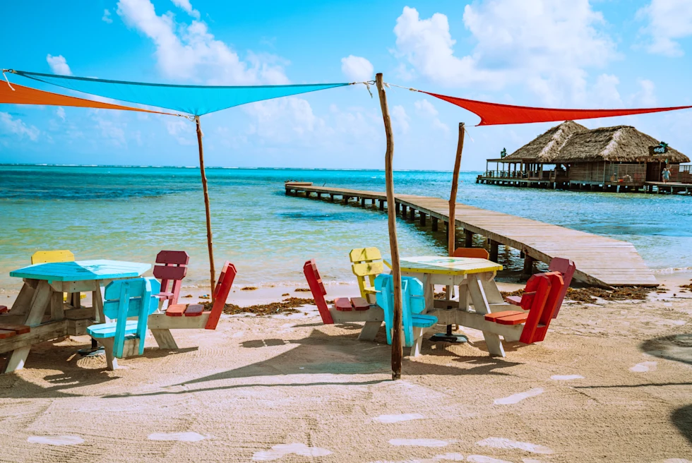 Beach view with wooden huts and chairs