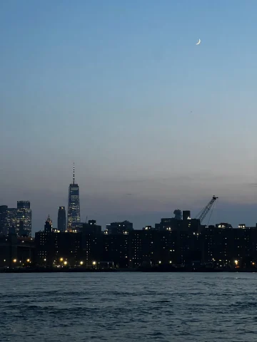 NYC skyline from across the East River after sunset
