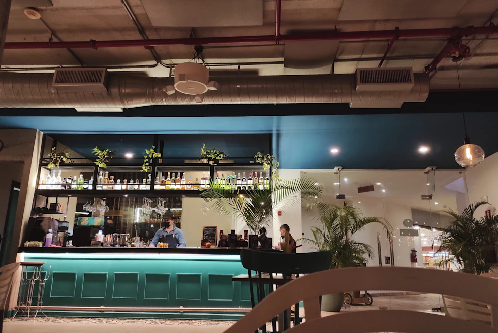 A restaurant with blue and sea green interior.