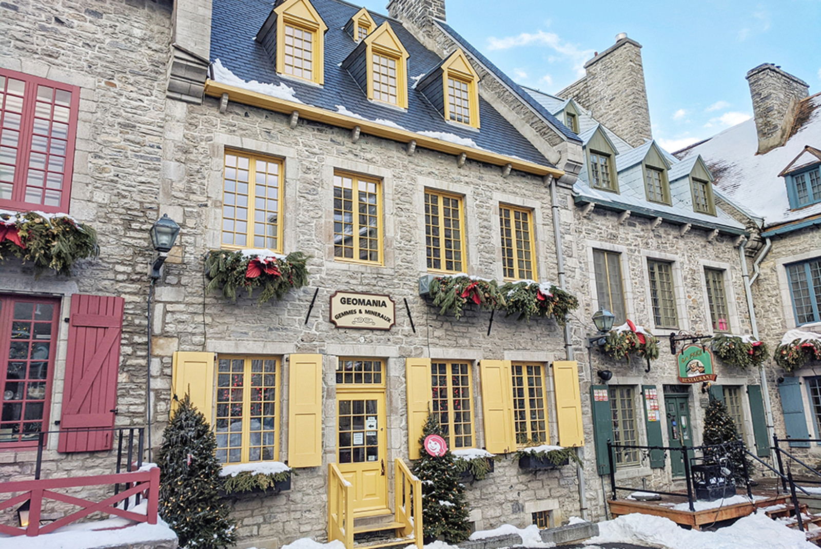 brown stone and yellow window doors in Quebec City Canada