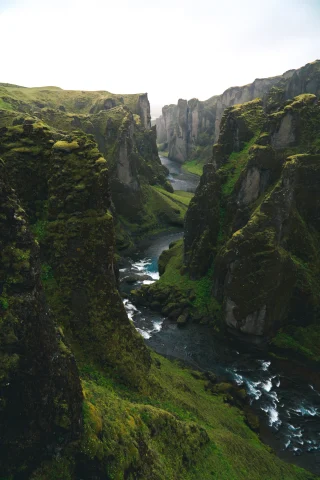 A green canyon with a river int he middle in Iceland.