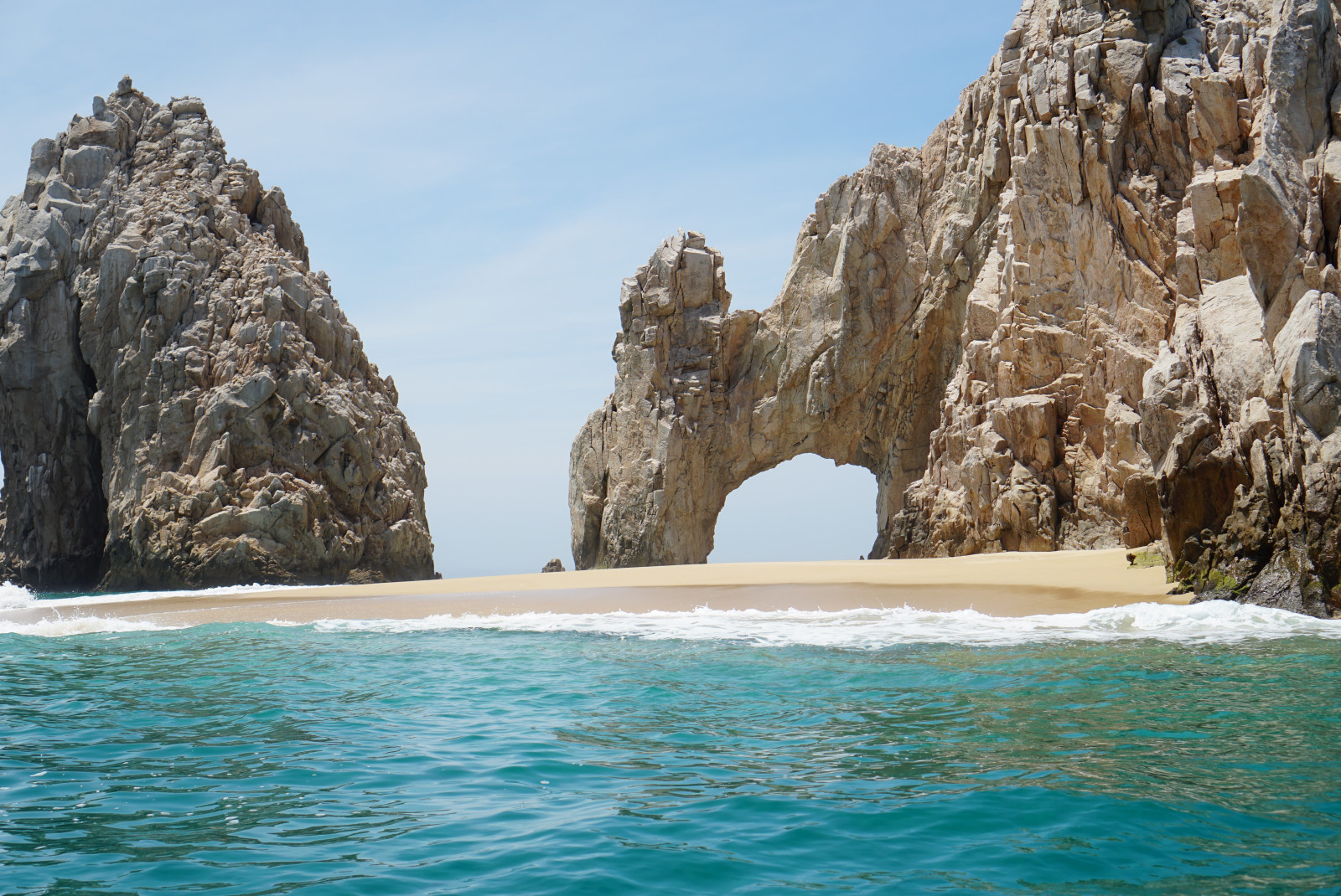 Cortes Sea rocks and white sand beach. 