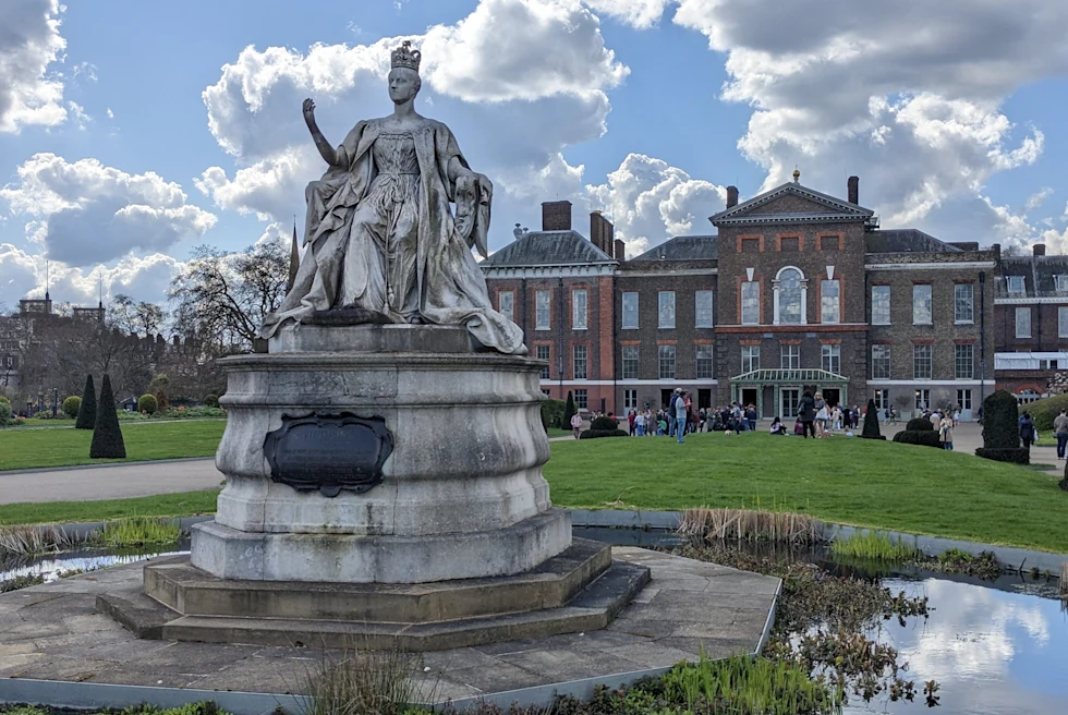 Old Victorian era buildings with a statue.
