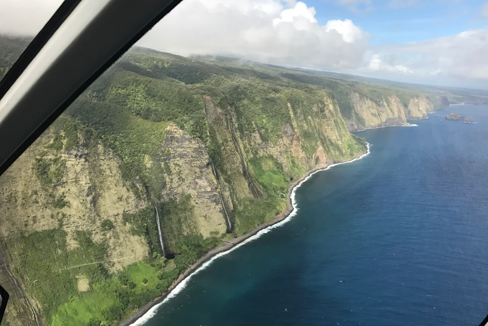 View of a green island from a helicopter