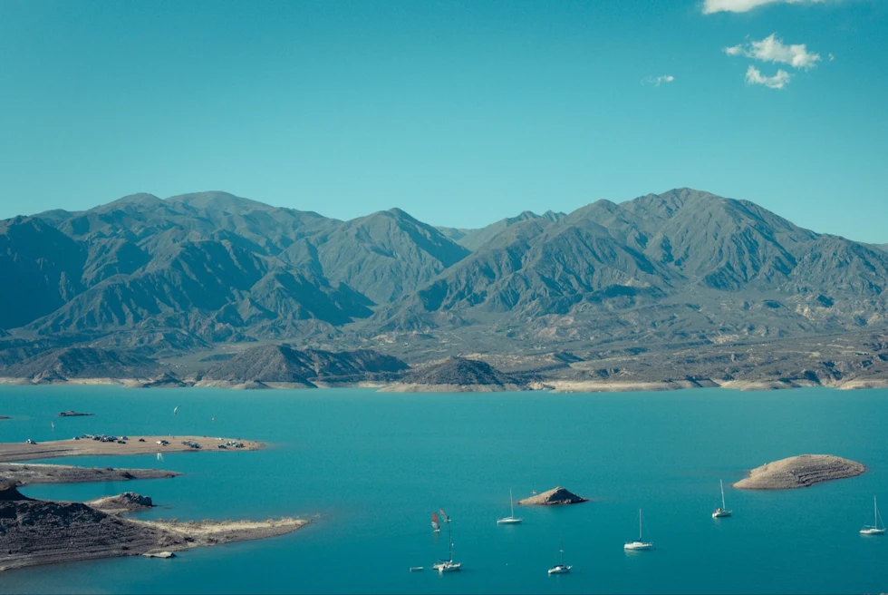 The Potrerillos Dam is a striking reservoir nestled in the Andes of Argentina, serving as a vital water source and a picturesque destination for outdoor enthusiasts.