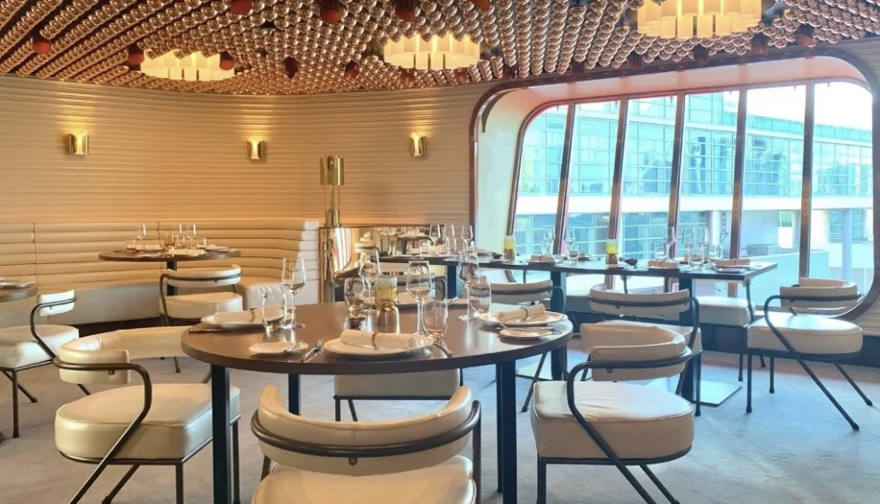 a cruise ship formal dining room with a large window
