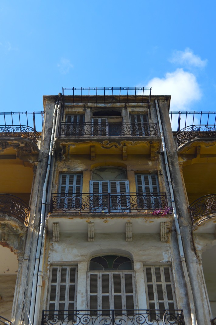 Three story with blue skies during daytime