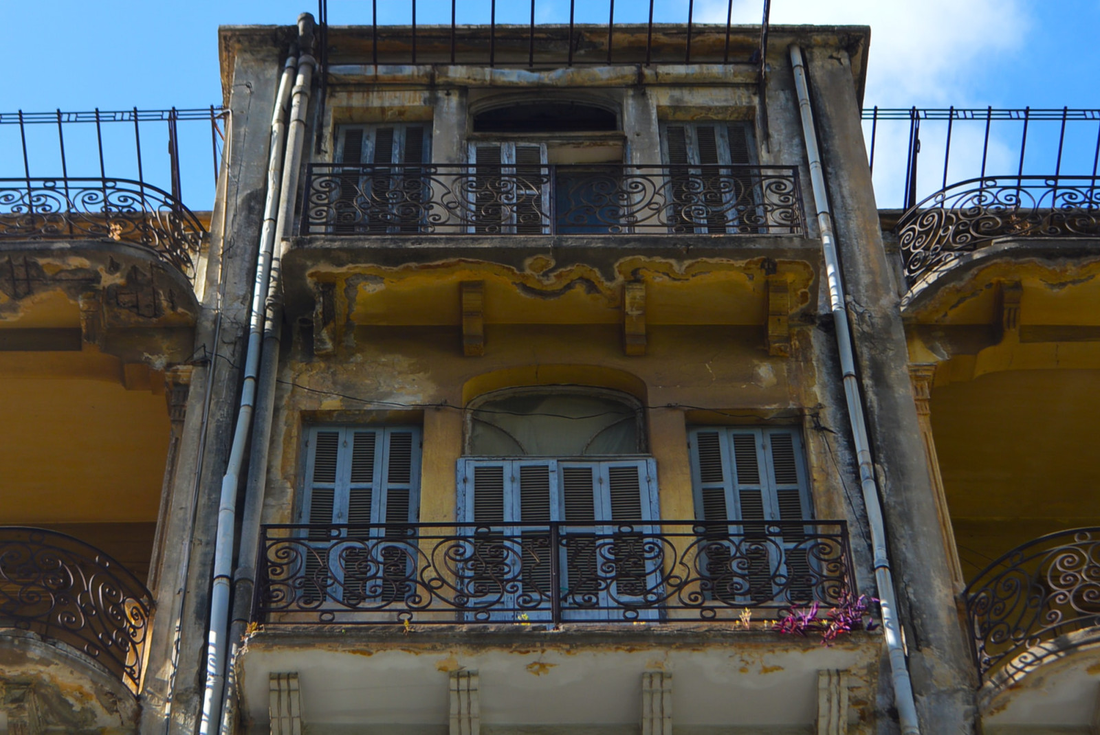 Three story with blue skies during daytime