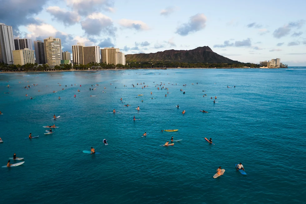 People enjoying in deep blue water