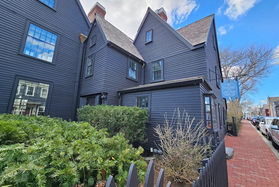black wooden home on a town street