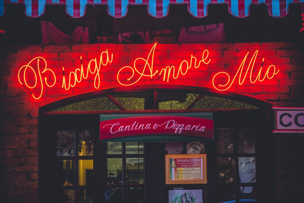 Restaurant with neon light at night time.