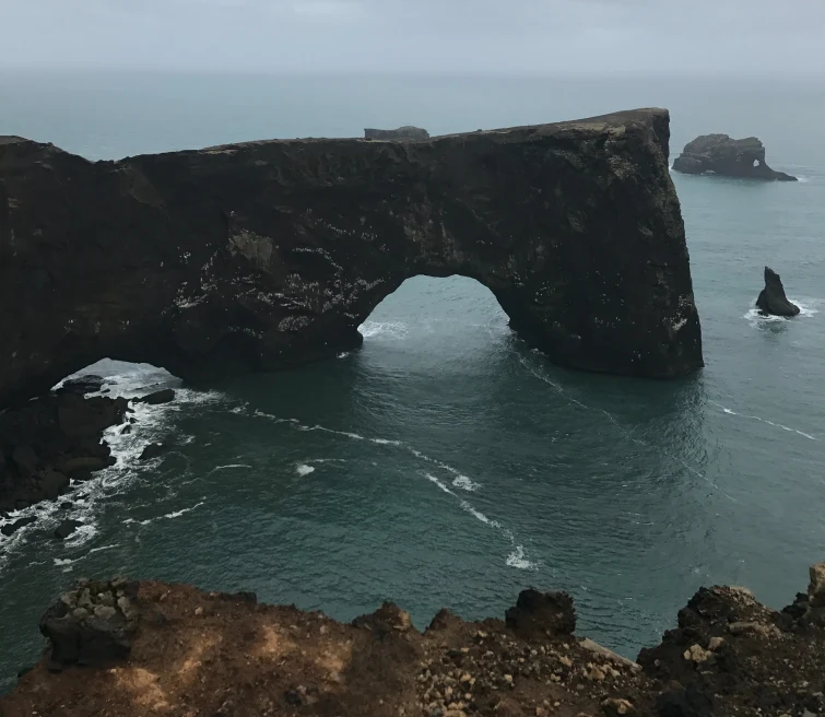 A rock with arch on the sea.