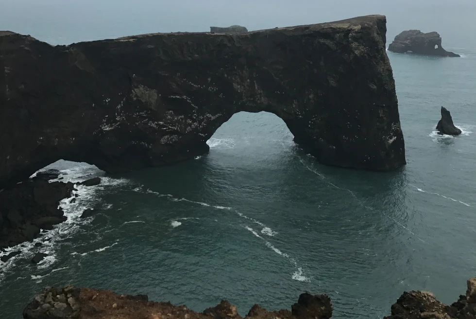 A rock with arch on the sea.