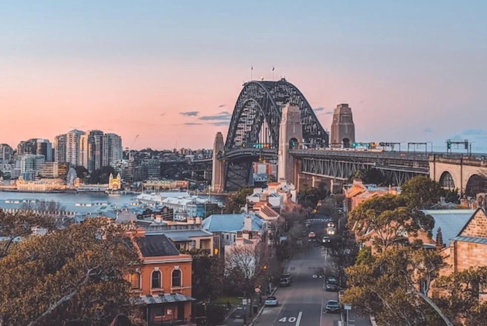 Views of Harbour Bridge in Sydney at sunset.