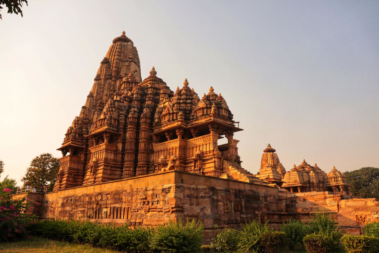 Golden Khajuraho temples in India during sunrise.