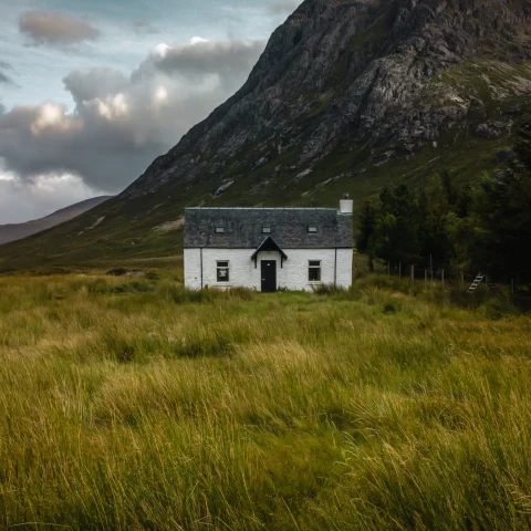 Scotland travel guide, field with house. 