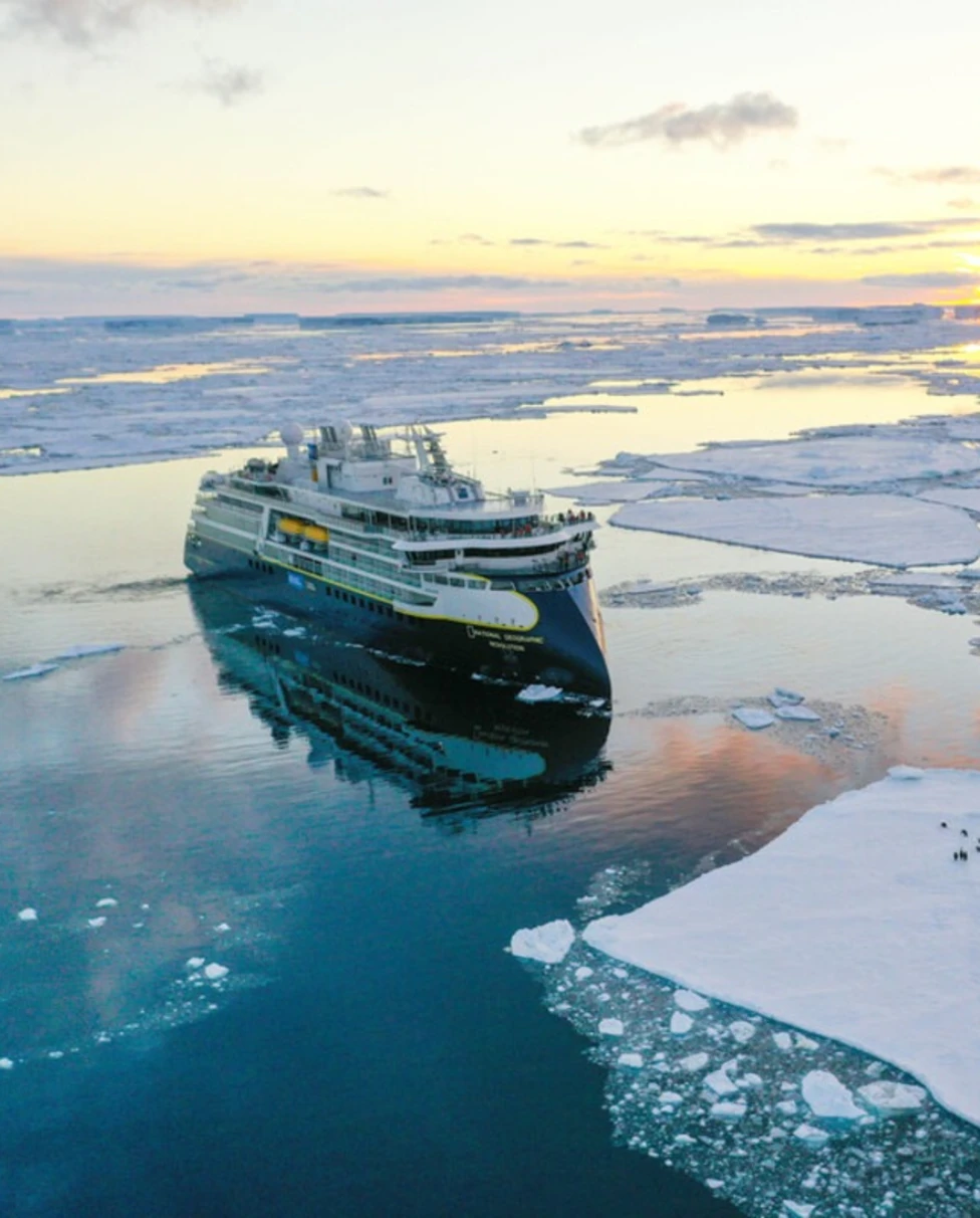 aerial view of a ship on an ice-covered ocean