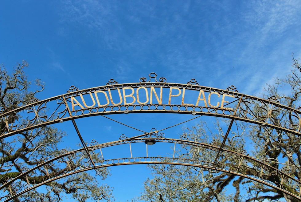 sign in blue sky reads, audubon place