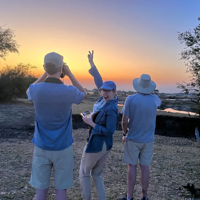 Picture of Lee with friends at sunset