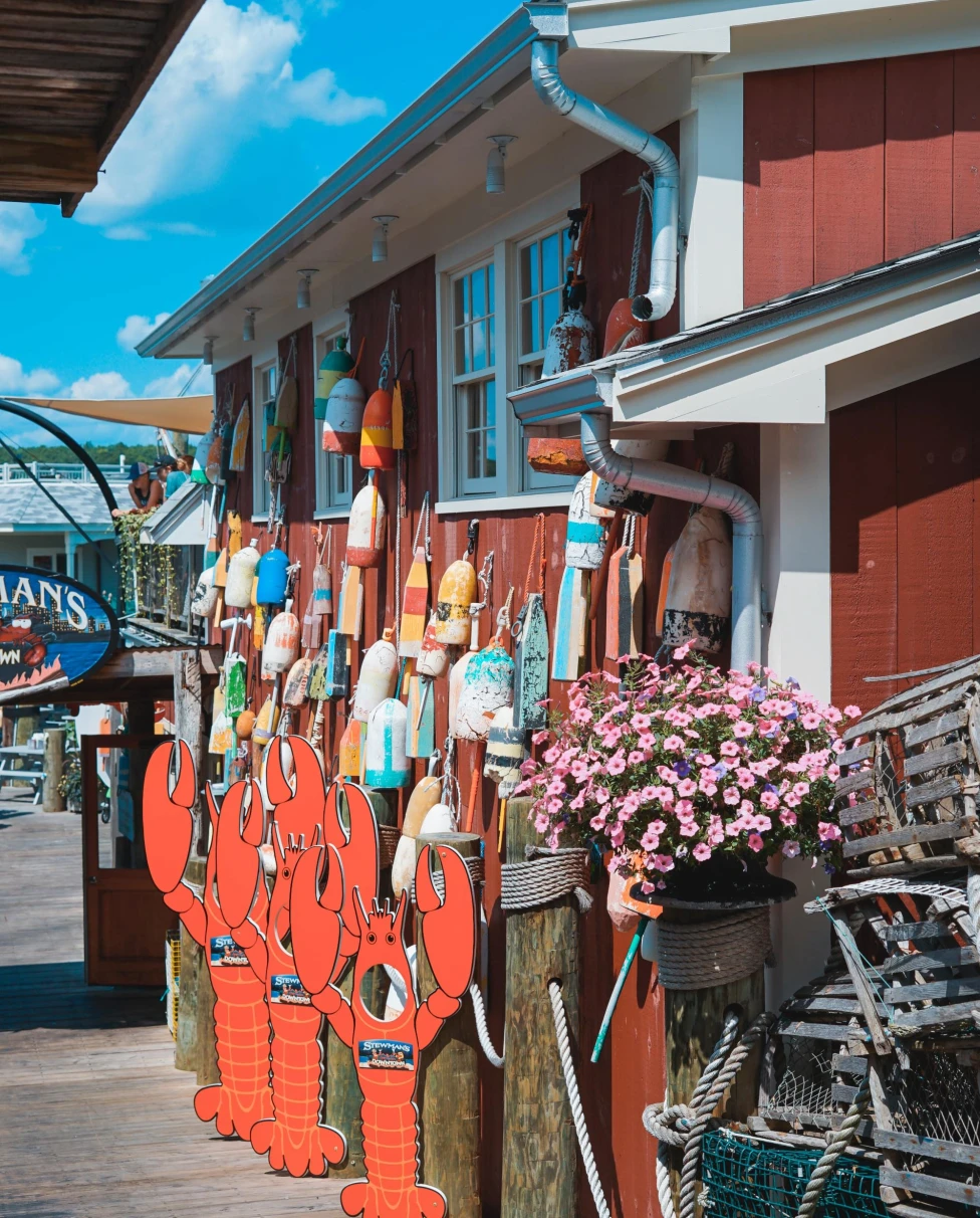 lobster shack with buoys hanging on the exterior  