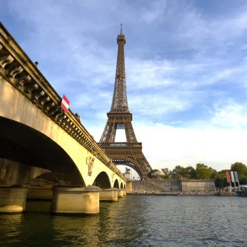 Eiffel tower as seen from city canal. 